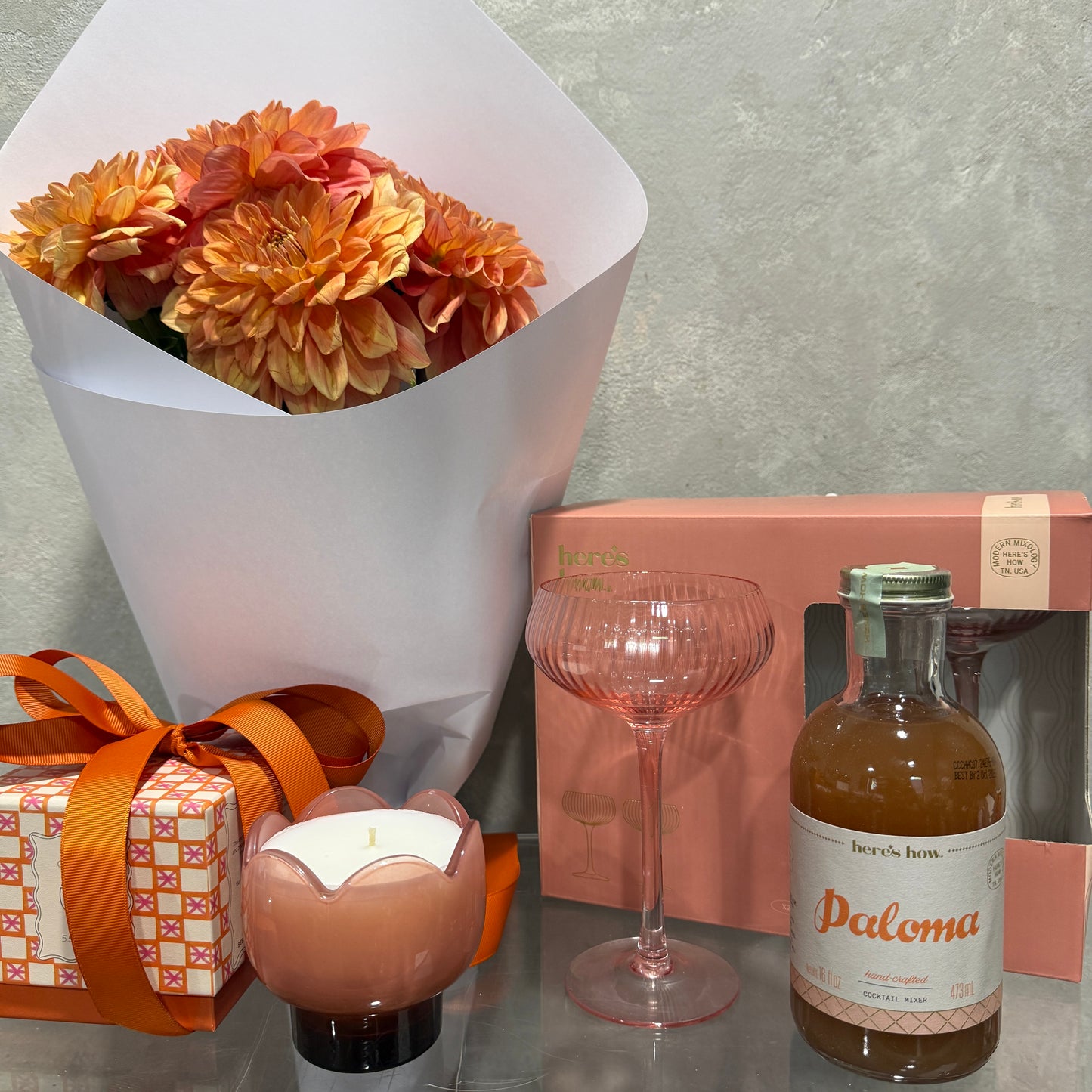 Orange Dahlias, Tulip Candle, Paloma Cocktail Mixer and Two Coupe Glasses