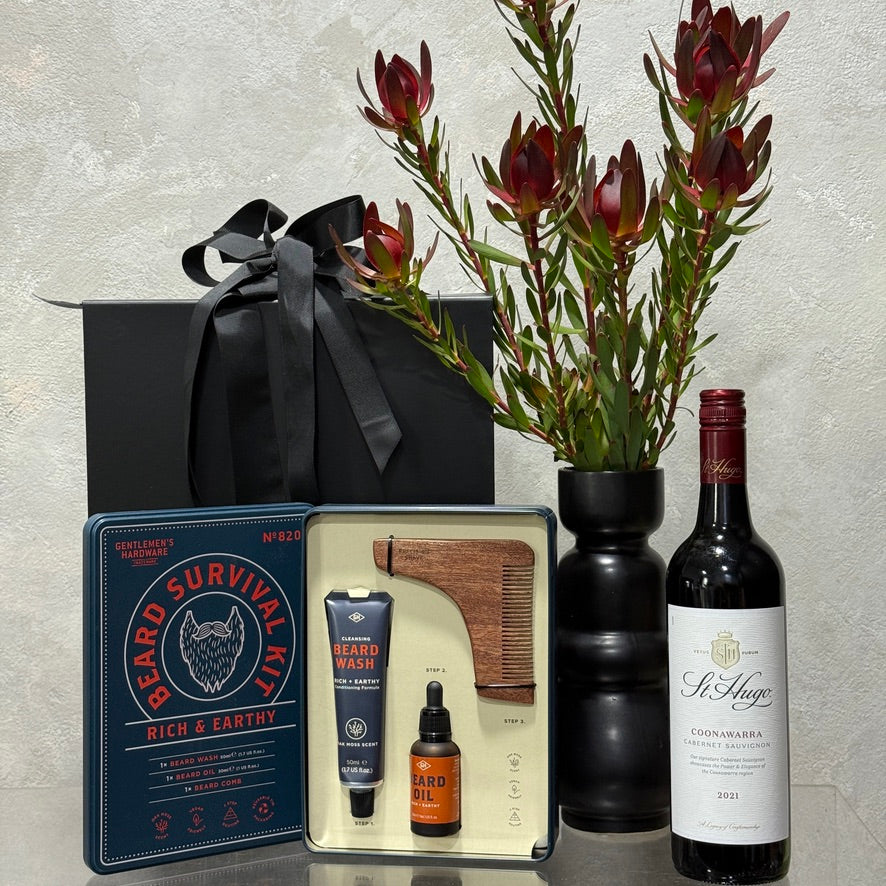Beard Grooming Kit with St Hugo Coonawarra Cabernet Sauvignon and leucadendrons in black vase