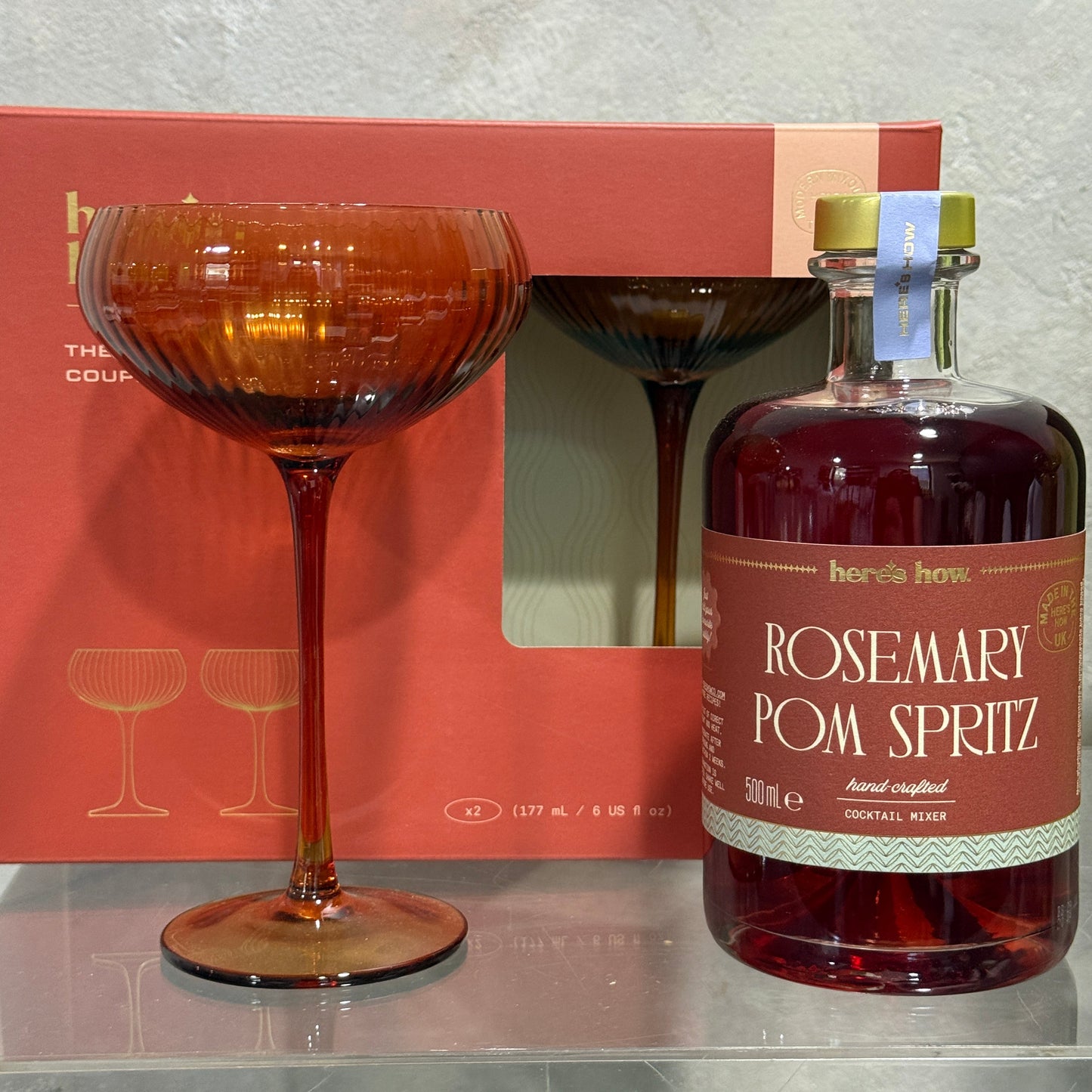 Rosemary Pom Spritz and Two Coupe Glasses