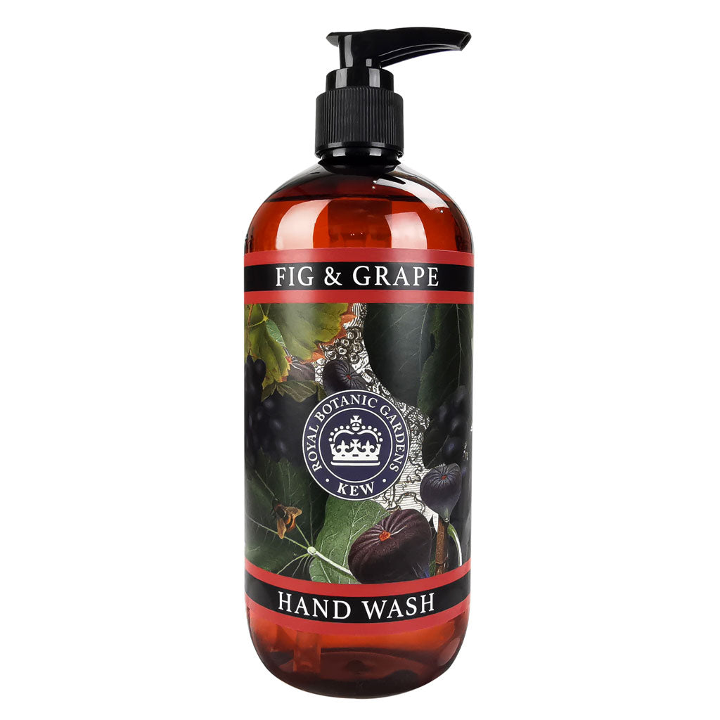 A pump bottle of hand wash called "KEW Hand Wash" by the brand Flowers on Norton St showcases an illustration of figs and grapes. The label proudly displays "Kew Royal Botanical Gardens." As part of their Floral Collection, the dark amber bottle with black and red accents exudes a sense of botanical luxury.