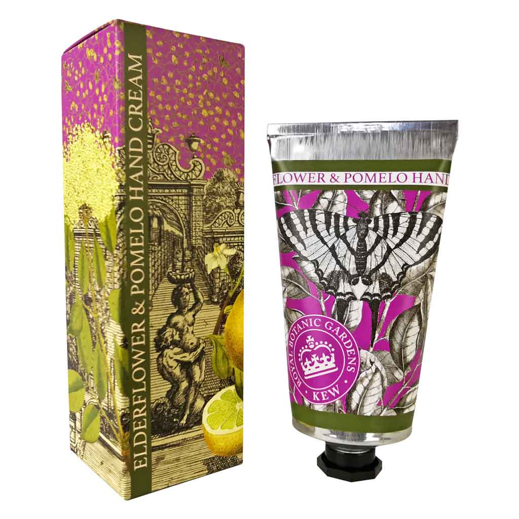 A tube of KEW Hand Cream by Flowers on Norton St is positioned beside its decorative box. The packaging, influenced by Kew Royal Botanical Gardens, showcases a vintage botanical design with illustrations of a butterfly and lemons.