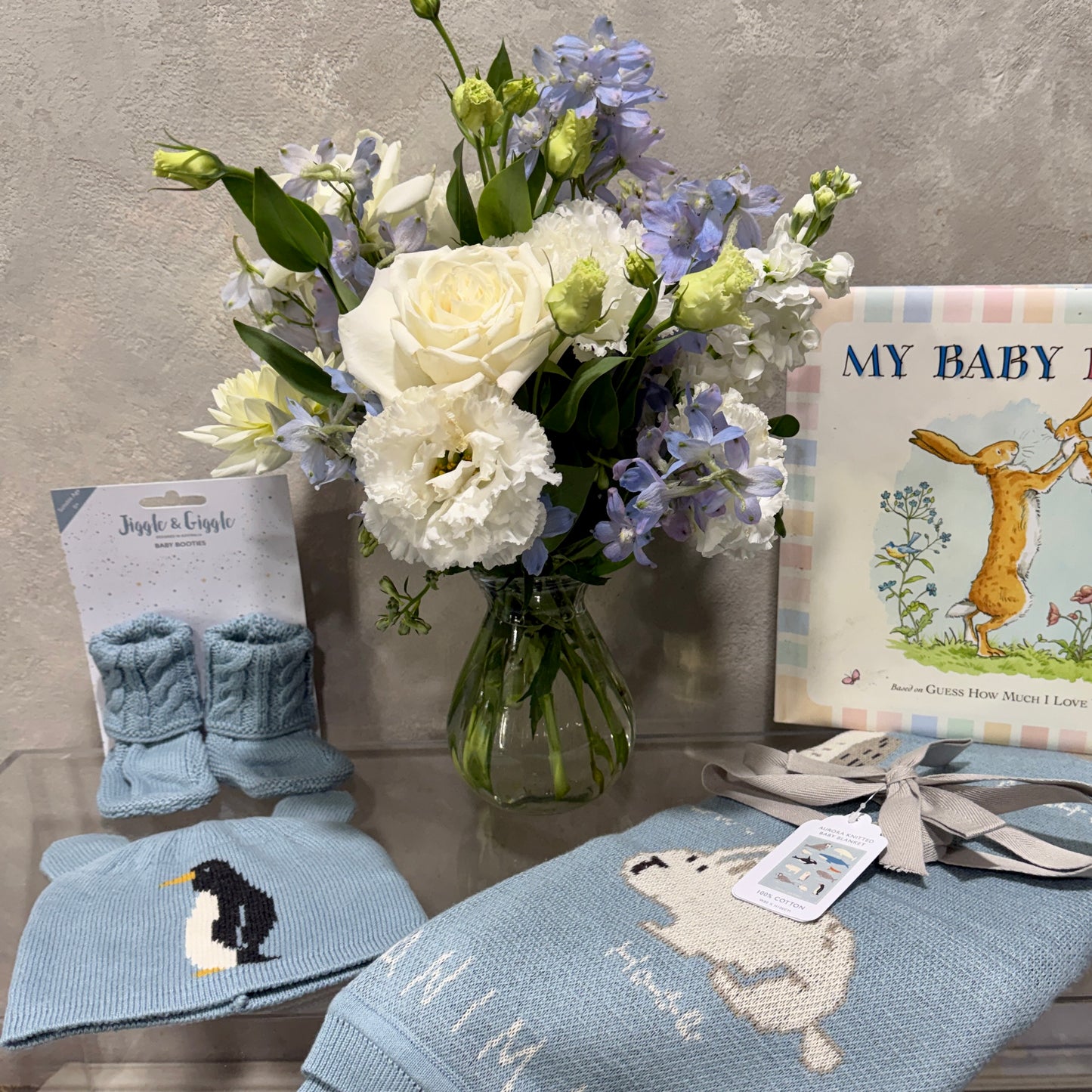 Blue Baby Hamper with Socks, Beanie, Blanket, 'My Baby Book' and Vase of Flowers