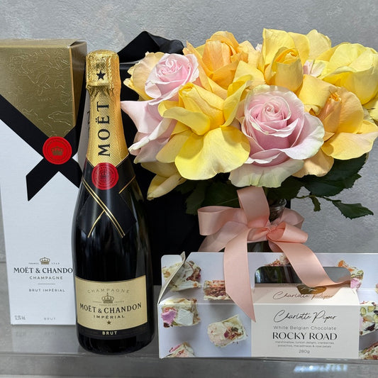 Moet, Charlotte Piper Rocky Road and Vase of Soft Pink and Yellow Roses