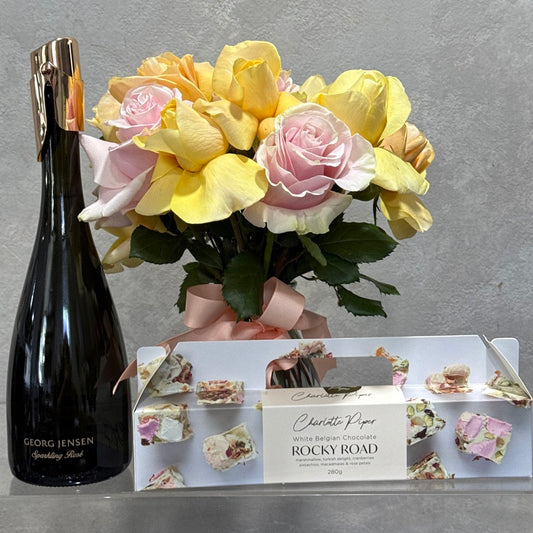 Georg Jensen Sparkling rose, Charlotte Piper Rocky Road and Vase of Soft Yellow and Pink Roses